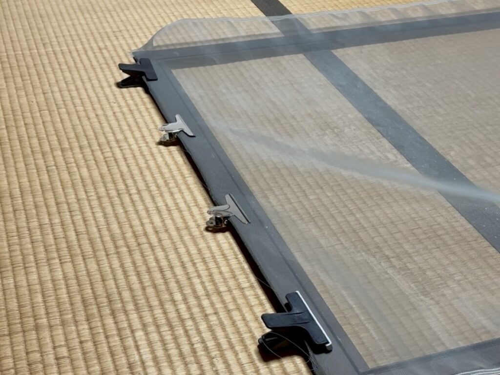 Using clips to hold the mesh in place