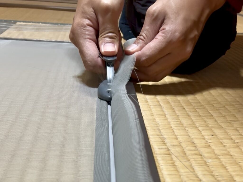 Trimming excess mesh along the frame
